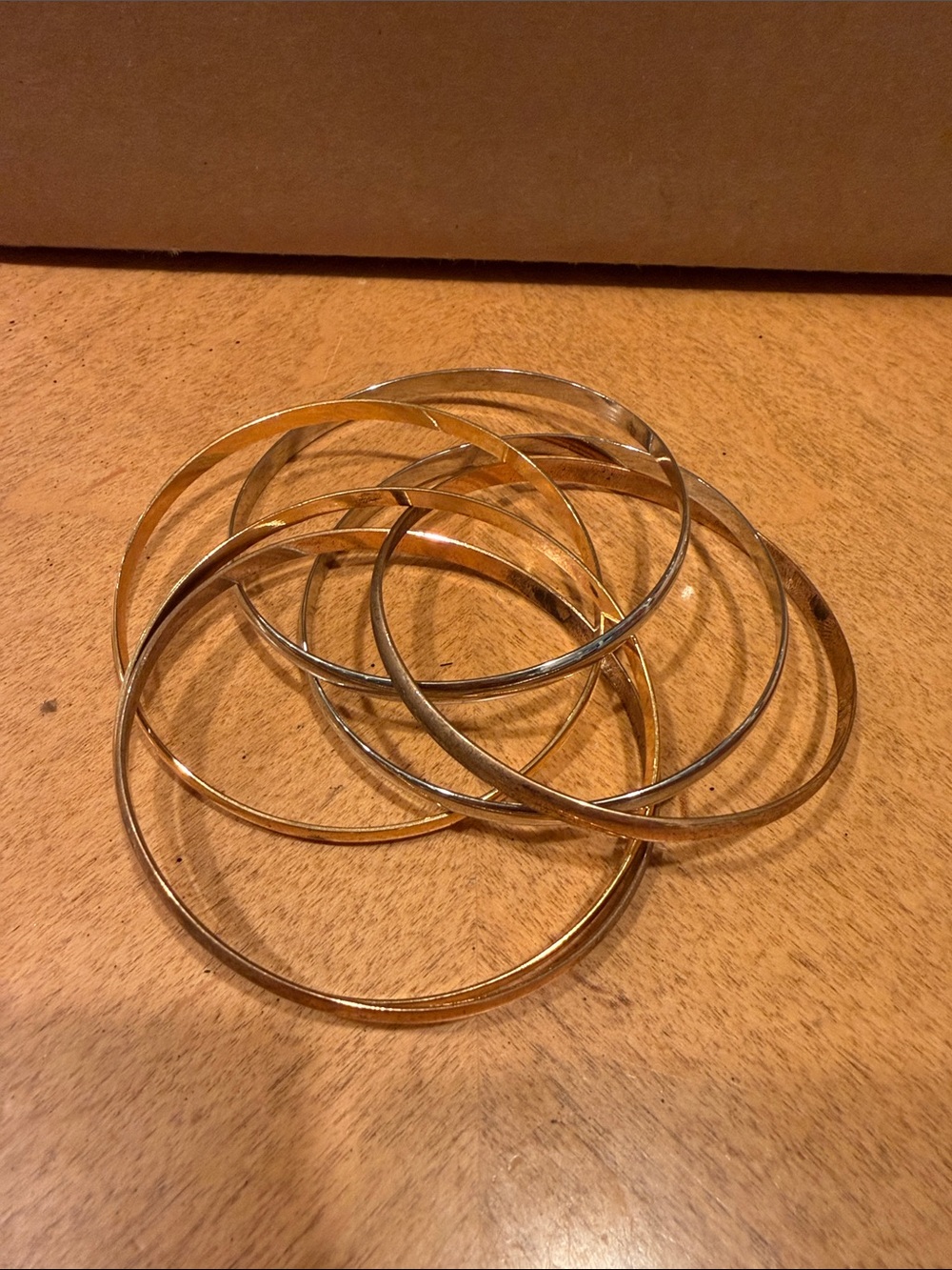 Stacked diff Gold Tone Intertwined  vintage bracelets